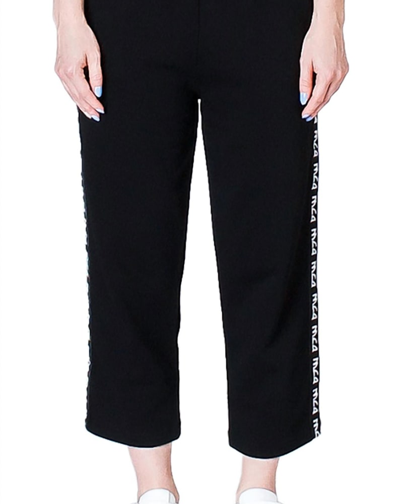 Front of a model wearing a size L Cropped Track Pants in Black in Black by MCQ ALEXANDER MCQUEEN. | dia_product_style_image_id:339466